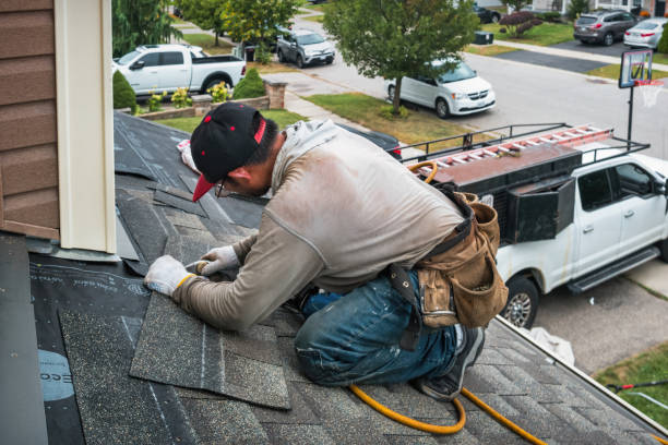 Professional Roofing technician working in Lee, MA